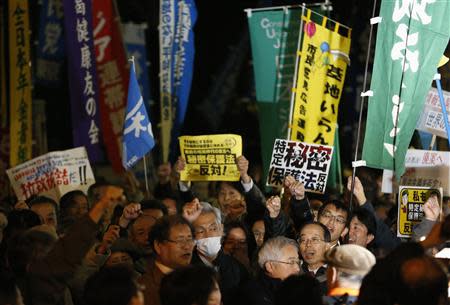 Protesters shout slogans during a march against the government's planned secrecy law in Tokyo November 21, 2013. REUTERS/Issei Kato