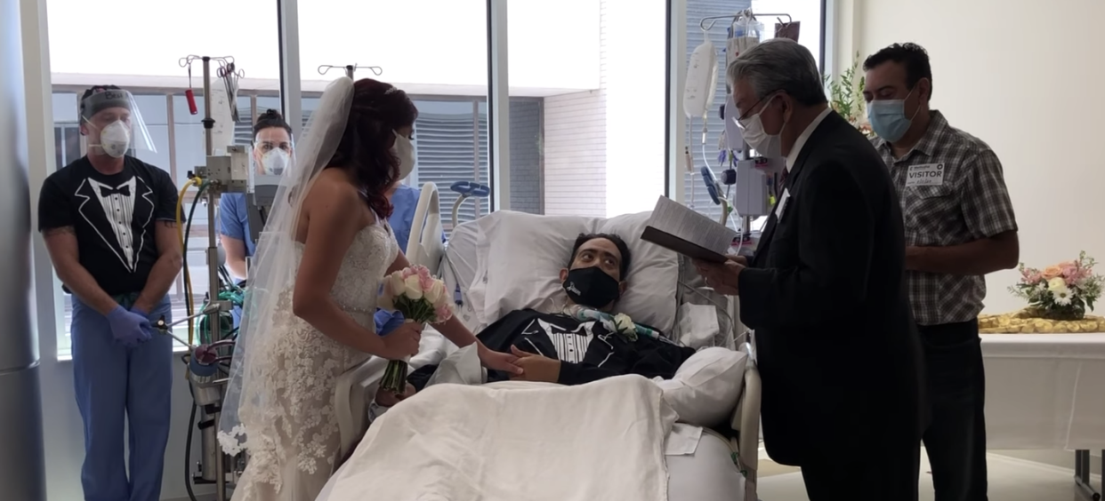 Groom Carlos Muniz and bride Grace Leimann exchange vows over Muniz's hospital bed while he fought coronavirus. (Photo: Methodist Hospital)