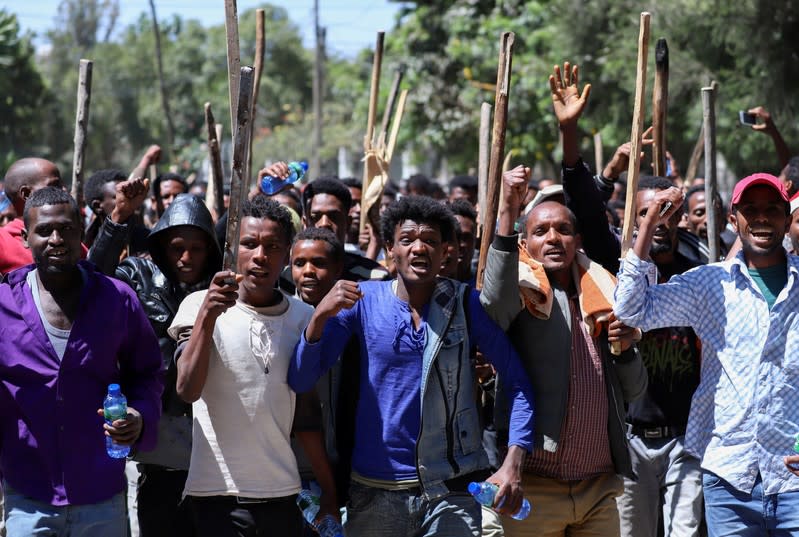 FILE PHOTO: Oromo youth chant slogans during a protest in-front of Jawar MohammedÕs house, an Oromo activist and leader of the Oromo protest in Addis Ababa, Ethiopia