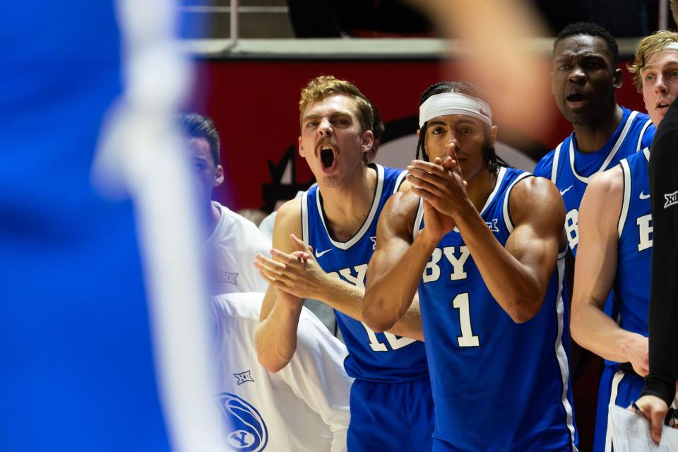 Brigham Young Cougars team members cheer during a men’s basketball game against the Utah Utes at the Jon M. Huntsman Center in Salt Lake City on Saturday, Dec. 9, 2023.