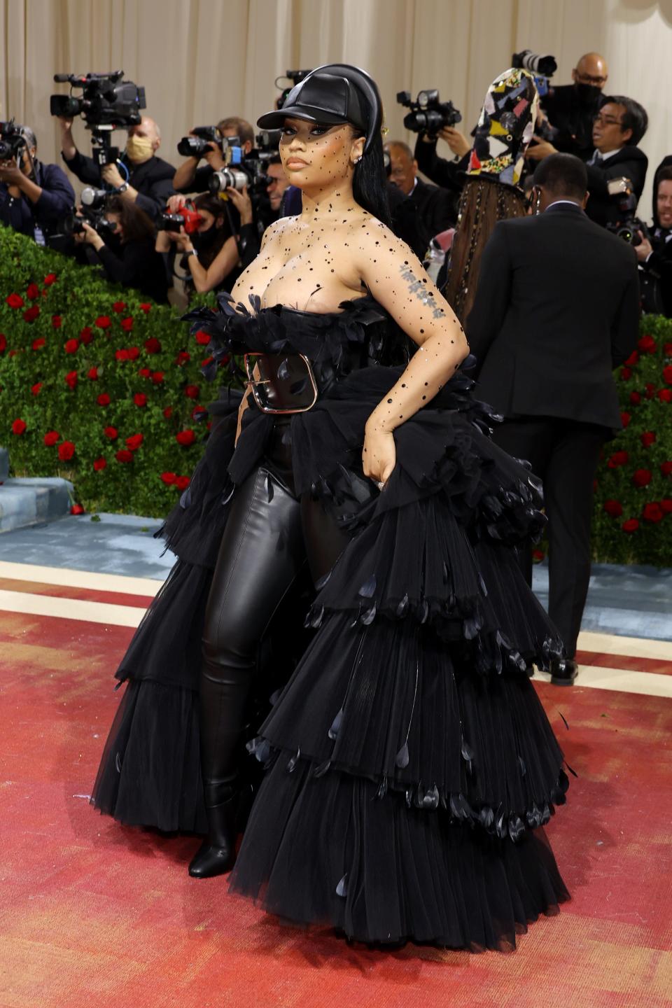 Nicki Minaj in a black ensemble and black hat at the 2022 Met Gala