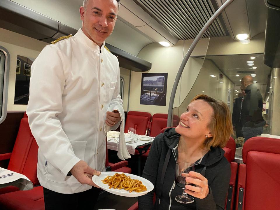 Writer Leslie enjoying an Italian feast on board Italy's new sleeper train