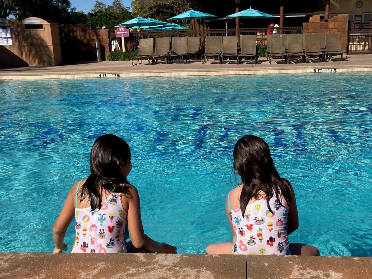 Young guests enjoy a morning dip at Coronado Springs Resort. Pools are heated and open all year round.