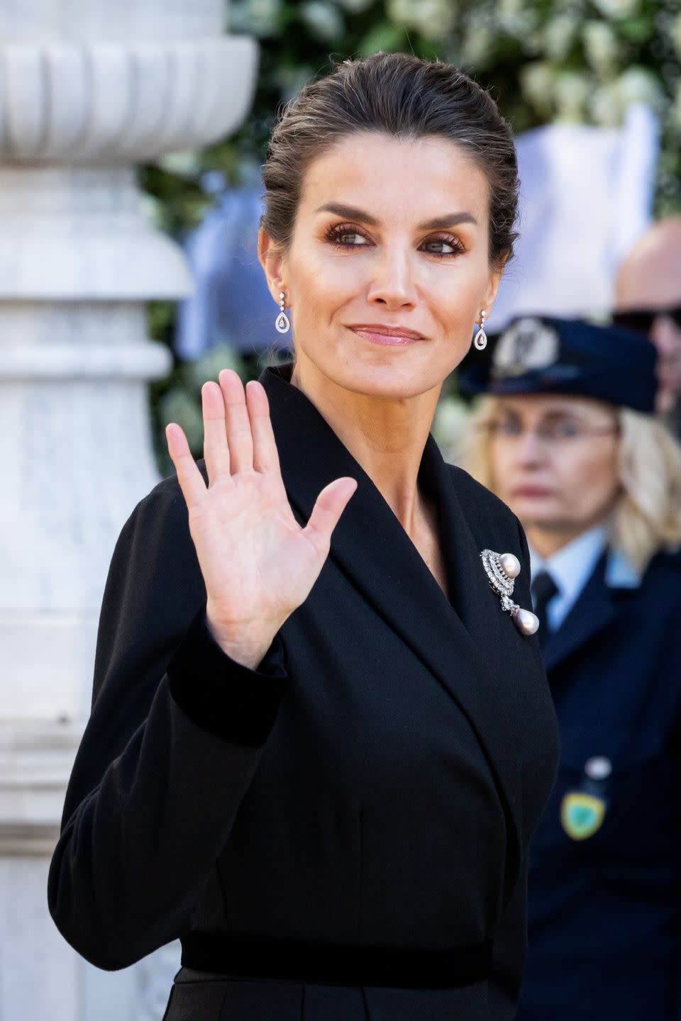 <p>Even at a funeral, <a href="https://www.townandcountrymag.com/society/tradition/g10297690/queen-letizia-style/" rel="nofollow noopener" target="_blank" data-ylk="slk:Queen Letizia looked glamorous;elm:context_link;itc:0;sec:content-canvas" class="link ">Queen Letizia looked glamorous</a> in a black coat dress, diamond drop earrings, and her "Joyas de Pasar" pearl and diamond brooch. Many royals wore pearls, a mourning tradition started by Queen Victoria. </p>