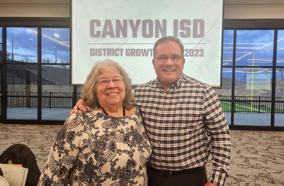 Bill Jenkins stands with his mom Carolyn at a farewell ceremony Monday at Happy State Bank Stadium in Canyon.