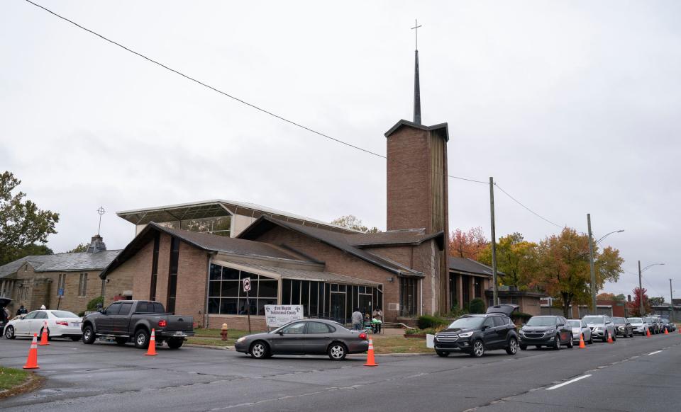 Cars wrap around the block at the First Baptist Institutional Church in Detroit on Wednesday, Oct. 19, 2022, during Senior Day, created by the Rev. Dr. Robyn Moore, the first woman to lead the First Baptist Institutional Church. Senior Day allows seniors twice a month to get free food items from the church with the partnership of Forgotten Harvest.