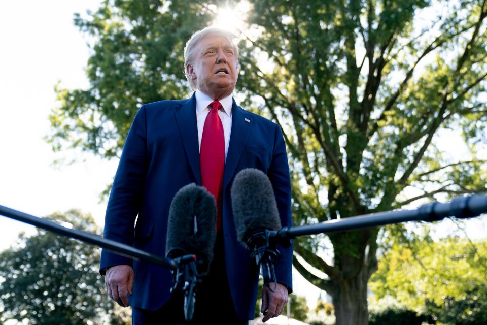 Donald Trump speaks to reporters before boarding Marine One on the South Lawn of the White House on 21 September. (AP)