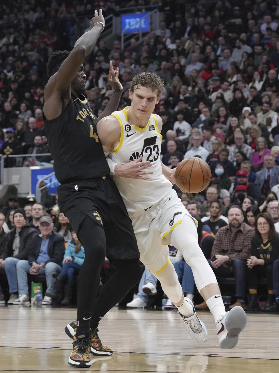 Utah Jazz's Lauri Markkanen, right, drives against Toronto Raptors' Pascal Siakam during the first half of an NBA basketball game Friday, Feb. 10, 2023, in Toronto. (Chris Young/The Canadian Press via AP)