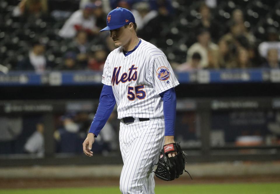 New York Mets relief pitcher Corey Oswalt leaves the field during the fifth inning of a baseball game against the Milwaukee Brewers Friday, April 26, 2019, in New York. (AP Photo/Frank Franklin II)