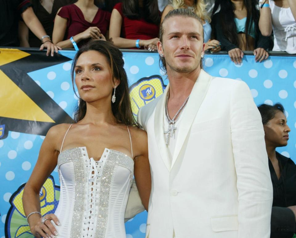 Victoria and David Beckham wear matching white outfits to the 2003 MTV Movie Awards in Los Angeles, California (Getty Images)