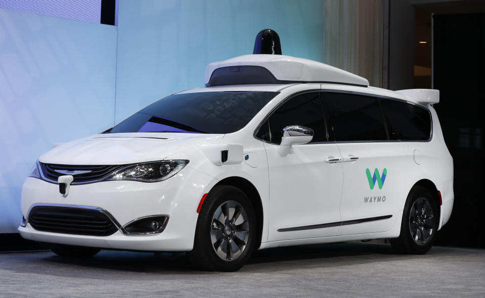 FILE - In this Jan. 8, 2017, file photo a Chrysler Pacifica hybrid outfitted with Waymo's suite of sensors and radar is displayed at the North American International Auto Show in Detroit. Google's self-driving car spinoff Waymo said Tuesday it will bring a factory to Michigan, creating up to 400 jobs at what it describes as the world's first plant "100 percent" dedicated to the mass production of autonomous vehicles. (AP Photo/Paul Sancya, File)