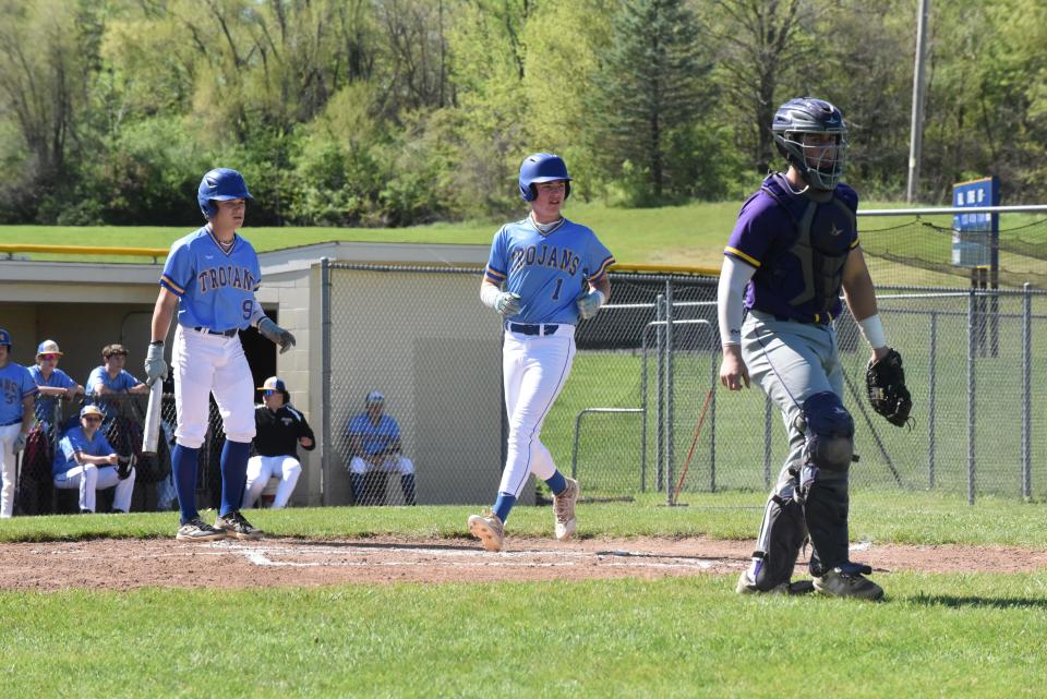 Madison's Brian Dopp scores a run during a doubleheader at home against Blissfield