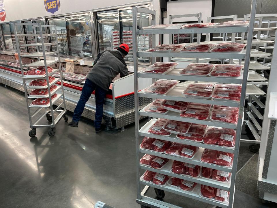 An employee restocks meats at a grocery store on Jan. 17, 2023, in North Miami, Fla. While prices are no longer rising at a pace experienced in much of 2021 and the first half of 2022, there is a long way to go to reduce inflation to the Fed’s goal of 2%.