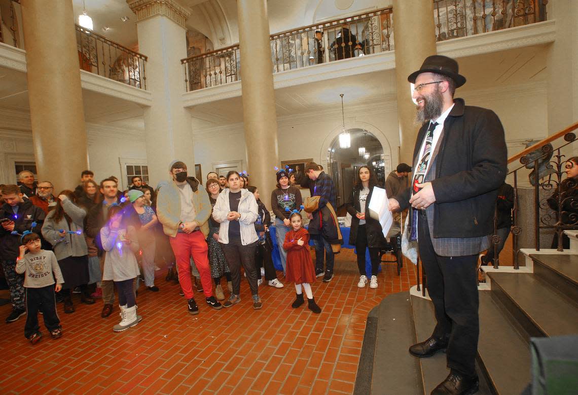 Rabbi Nosson Meretsky of Chabad of Penn State addresses the crowd before Sunday’s lighting of a 6 foot tall public Jewish Hanukkah menorah on the fourth night of the eight-day Festival of Lights at Old Main.