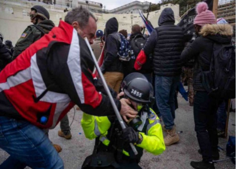 FILE: Thomas Webster, with hands on face of Capitol Police, January 6, 2021. / Credit: Federal charging documents