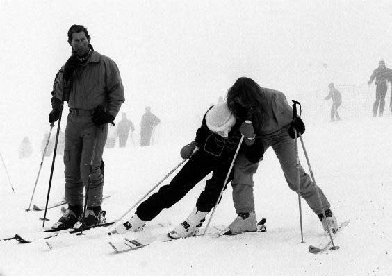 February 1987: Charles watches sisters-in-law Di and Fergie larking about on the slopes of chic winter resort Klosters, in the Swiss Alps (PA)