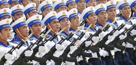 Sailors hold Israeli-made Galil riffles while marching during a celebration to mark National Day at Ba Dinh square in Hanoi September 2, 2015. Photo taken September 2, 2015. REUTERS/Kham -