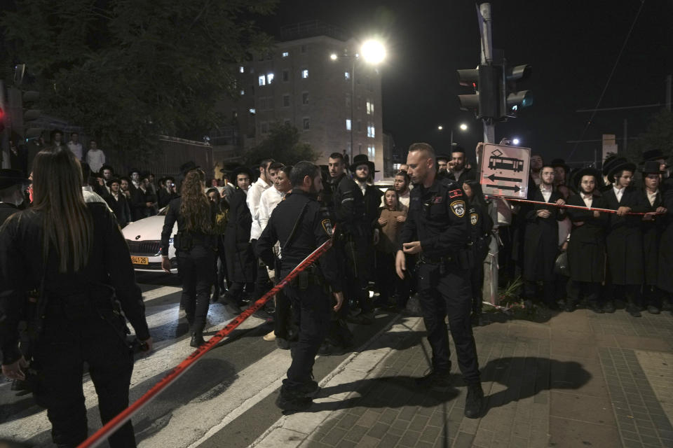 Israeli police cordon off a crime scene at a light rail train station after a stabbing in Jerusalem, Wednesday, Aug. 30, 2023. Israeli police said a Palestinian assailant stabbed an Israeli man near a light-rail station before the attacker was shot and killed by police. Israeli paramedics said the Israeli man was moderately wounded, and pronounced the attacker dead. (AP Photo/Mahmoud Illean)