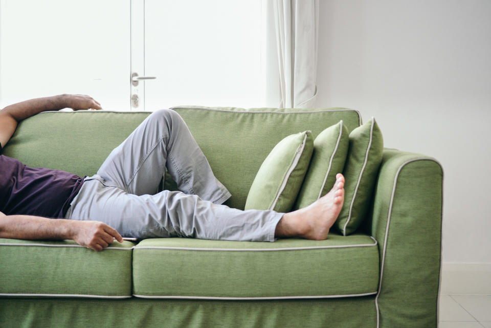 a man lying on the couch