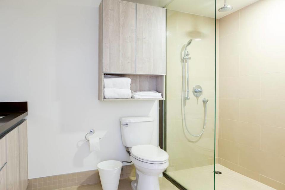 <p>There are also three bathrooms, including this master suite with walk-in shower. (Airbnb) </p>