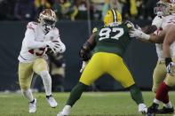 San Francisco 49ers' Deebo Samuel tries to get past Green Bay Packers' Kenny Clark during the first half of an NFC divisional playoff NFL football game Saturday, Jan. 22, 2022, in Green Bay, Wis. (AP Photo/Aaron Gash)
