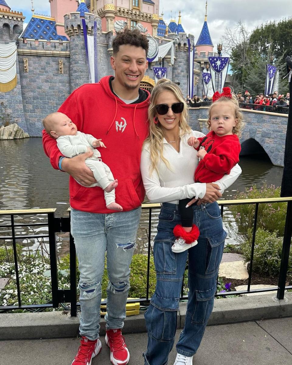 Patrick Mahomes Poses with Baby Son Bronze, Mickey and Minnie Mouse