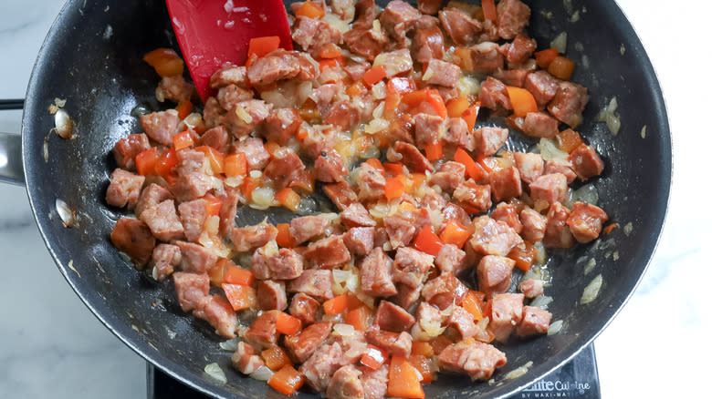 sauteeing sausage peppers onions