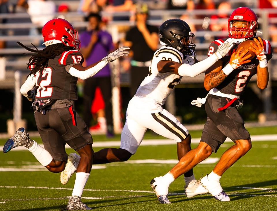 Bradford's Chalil Cummings (2) intercepts a pass in spring against Gainesville Buchholz.