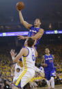 Los Angeles Clippers' Blake Griffin, shoots over Golden State Warriors' David Lee (10) during the first half in Game 3 of an opening-round NBA basketball playoff series, Thursday, April 24, 2014, in Oakland, Calif. (AP Photo/Marcio Jose Sanchez)