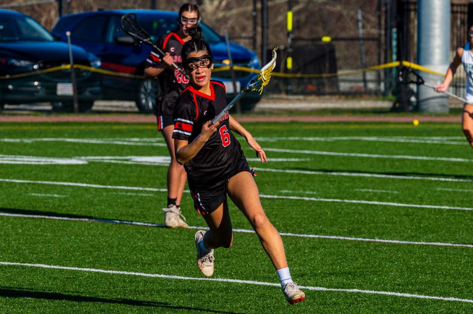 Old Rochester's Caroline Brogioli looks at her options up the field.