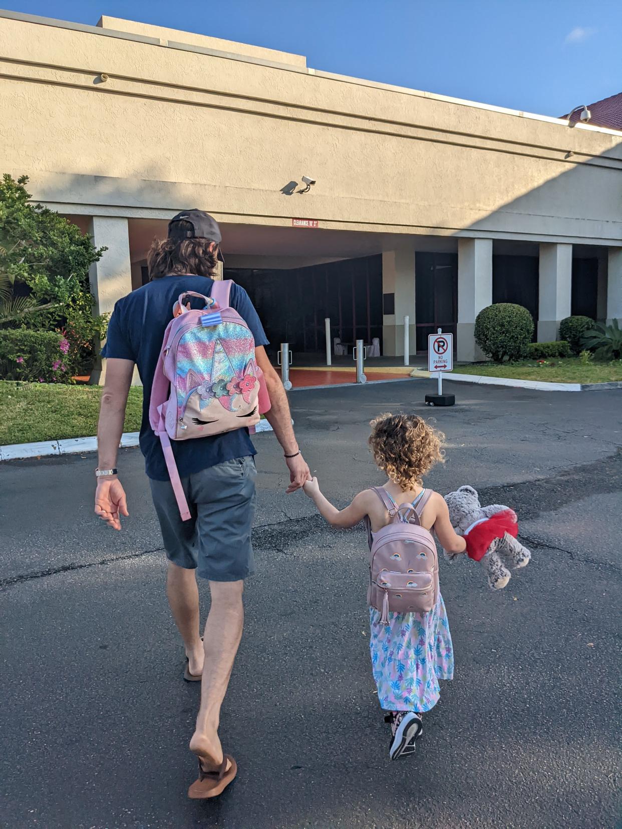 Ben Smithers walks daughter Charlotte Smithers to prekindergarten at Jacksonville's Jewish Community Alliance.