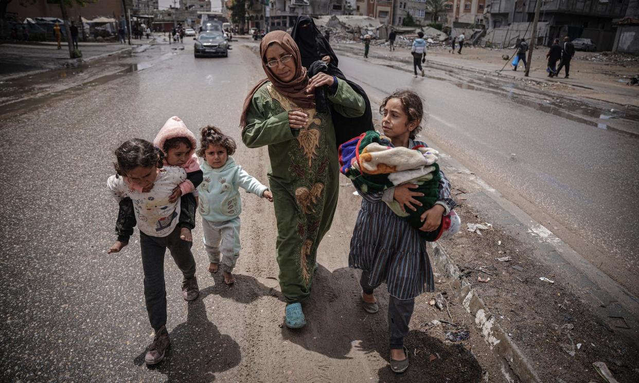 <span>Palestinian families flee east of Rafah in Gaza as Israel launches attack.</span><span>Photograph: Saher Alghorra/Zuma Press Wire/Rex/Shutterstock</span>