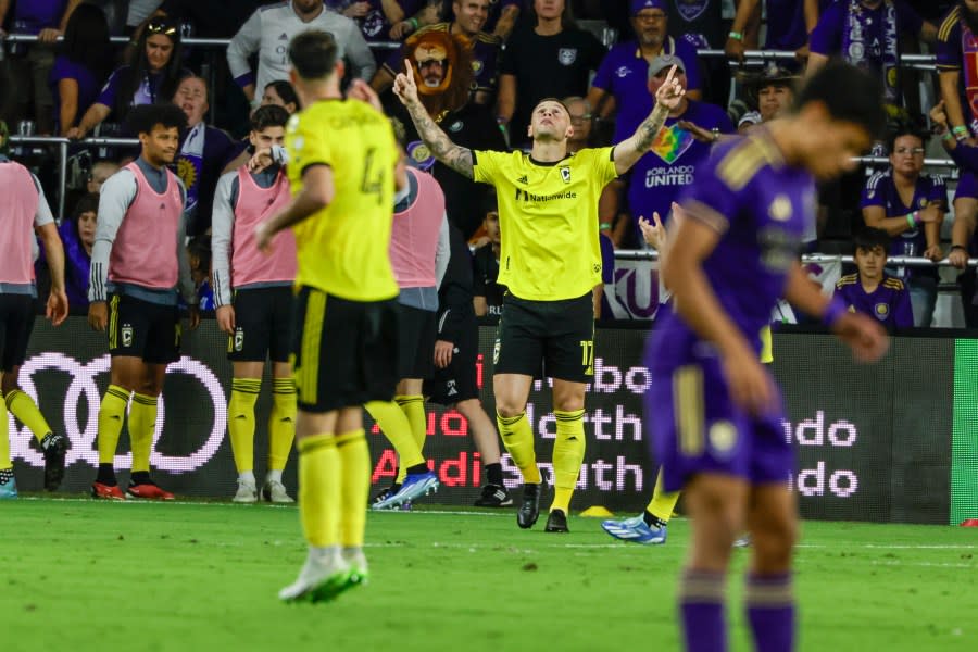 Columbus Crew forward Christian Ramirez, middle, celebrates after scoring a goal against Orlando City during over-time of an MLS soccer playoff match, Saturday, Nov. 25, 2023, in Orlando, Fla. (AP Photo/Kevin Kolczynski)