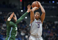 FILE - In this Wednesday, Feb. 19, 2020, file photo, Connecticut's Megan Walker, right, shoots over Tulane's Irina Parau in the second half of an NCAA college basketball game, in Hartford, Conn. Walker has submitted paperwork to enter the WNBA draft, which is scheduled to be held April 17, 2020. (AP Photo/Jessica Hill, File)
