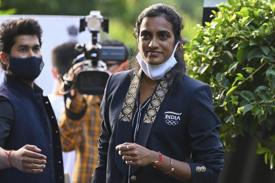 Winner of women's singles badminton bronze medal at Tokyo Olympics 2020, P.V. Sindhu (R)arrives at Indian Sports Minister Anurag Thakur's (not pictured) residence in New Delhi on August 3, 2021. (Photo by Prakash SINGH / AFP) (Photo by PRAKASH SINGH/AFP via Getty Images)
