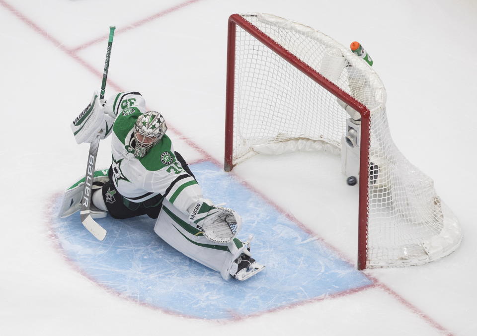 Dallas Stars goalie Anton Khudobin gives up a goal to the Colorado Avalanche during the first period in Game 1 of an NHL hockey playoff second-round series, in Edmonton, Alberta, Saturday, Aug. 22, 2020. (Jason Franson/The Canadian Press via AP)