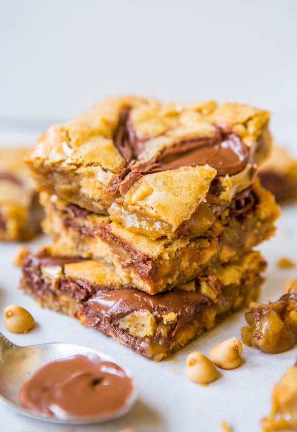 <strong>Get the <a href="https://www.averiecooks.com/2013/08/nutella-swirled-peanut-butter-chip-blondies.html" target="_blank">Nutella-Swirled Peanut Butter Chip Blondies</a> recipe from Averie Cooks</strong>