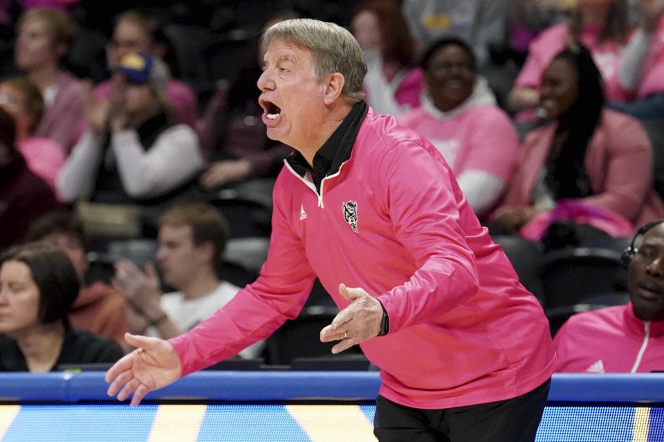 North Carolina State head coach Wes Moore calls out to his team during the first half of an NCAA college basketball game against Pittsburgh Sunday, Feb. 11, 2024, in Pittsburgh. (AP Photo/Matt Freed)