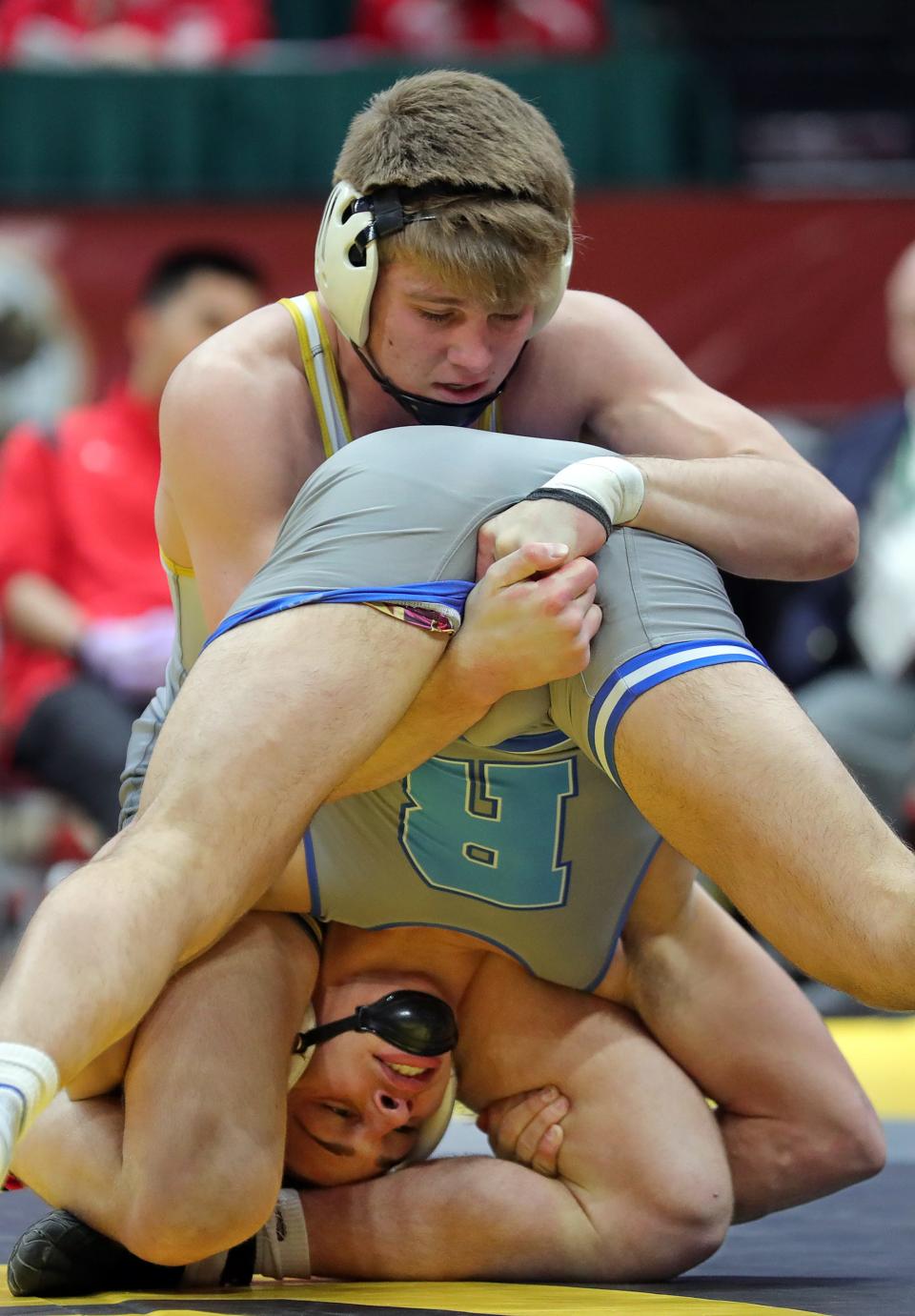 Hunter Andel of Garrettsville Garfield, top, works over Cody Coontz of Rootstown during their 165-pound Division III championship match in the OHSAA State Wrestling Tournament at the Jerome Schottenstein Center, Sunday, March 12, 2023, in Columbus, Ohio.