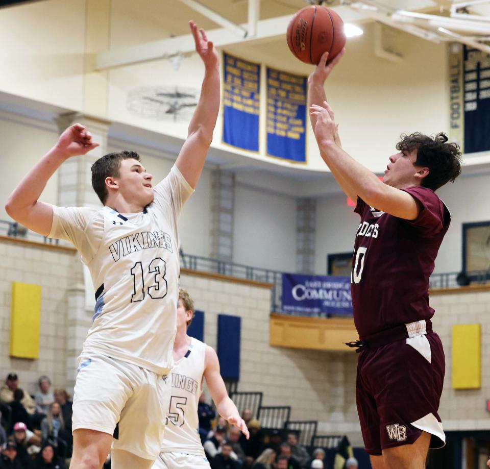 West Bridgewater's Nathan Hancock takes a shot at the basket over East Bridgewater's Dylan Kaplinger during a game on Thursday, Feb. 2, 2023. 