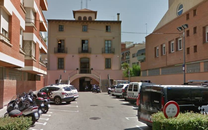 Police said the man entered the police station in Cornella 'with the aim of attacking the agents'