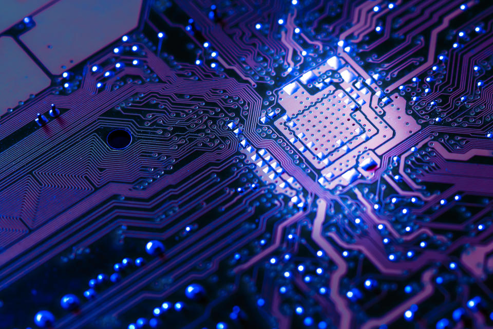 An illuminated view of an electronic circuit board.
