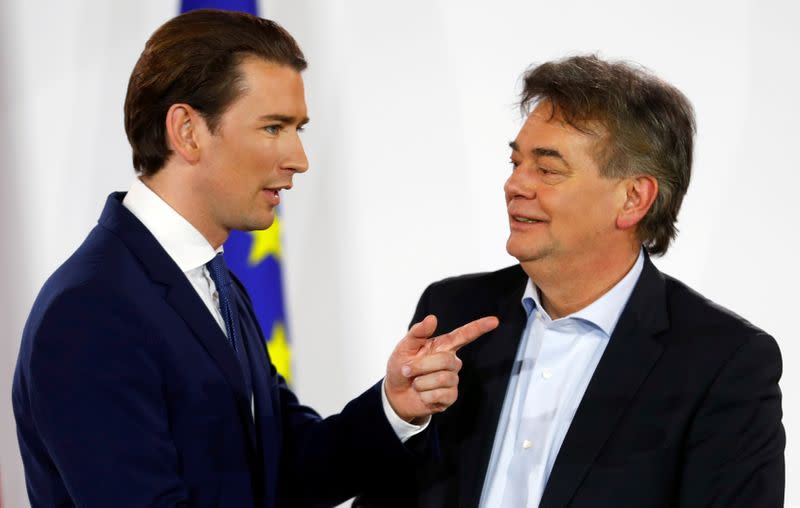 FILE PHOTO: Head of Austria's Green Party Werner Kogler and head of People's Party (OeVP) Sebastian Kurz talk after delivering a statement in Vienna