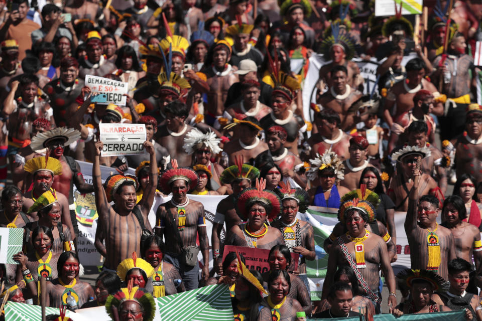 FILE - Indigenous people march during the 20th annual Free Land Indigenous Camp in Brasilia, Brazil, Tuesday, April 23, 2024. Thousands of Indigenous people continue to march on Thursday, April 25, calling on the government to officially recognize lands they have lived on for centuries and to protect territories from criminal activities like illegal mining. (AP Photo/Luis Nova, File)