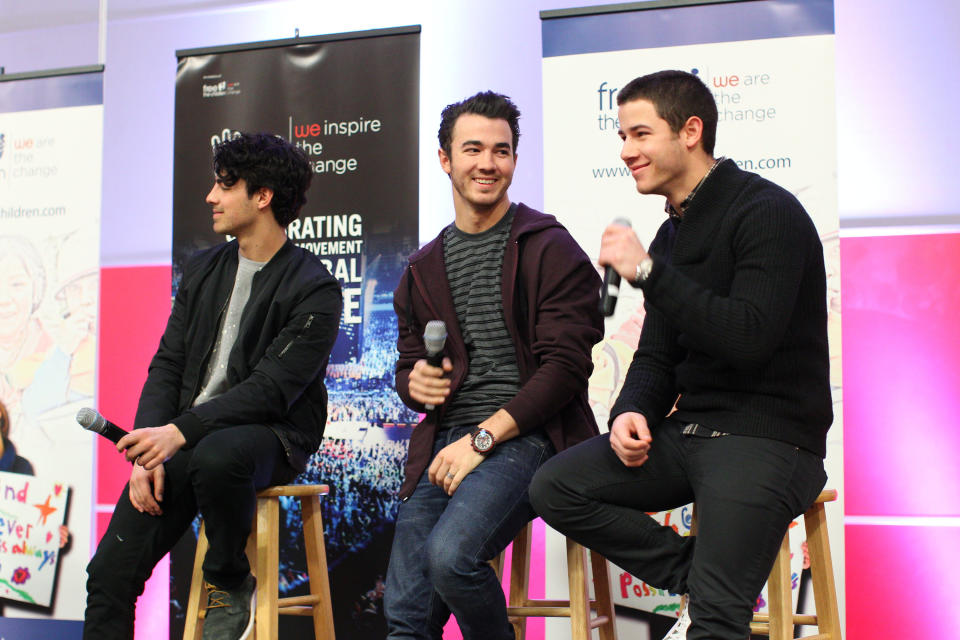 MINNEAPOLIS, MN - FEBRUARY 06: (L-R) Joe Jonas, Kevin Jonas and Nick Jonas of the musical trio the Jonas Brothers surprise 600 students at Minneapolis Patrick Henry High School to launch 'We Day' on February 6, 2013 in Minneapolis, Minnesota.  (Photo by Adam Bettcher/Getty Images for Free The Children)