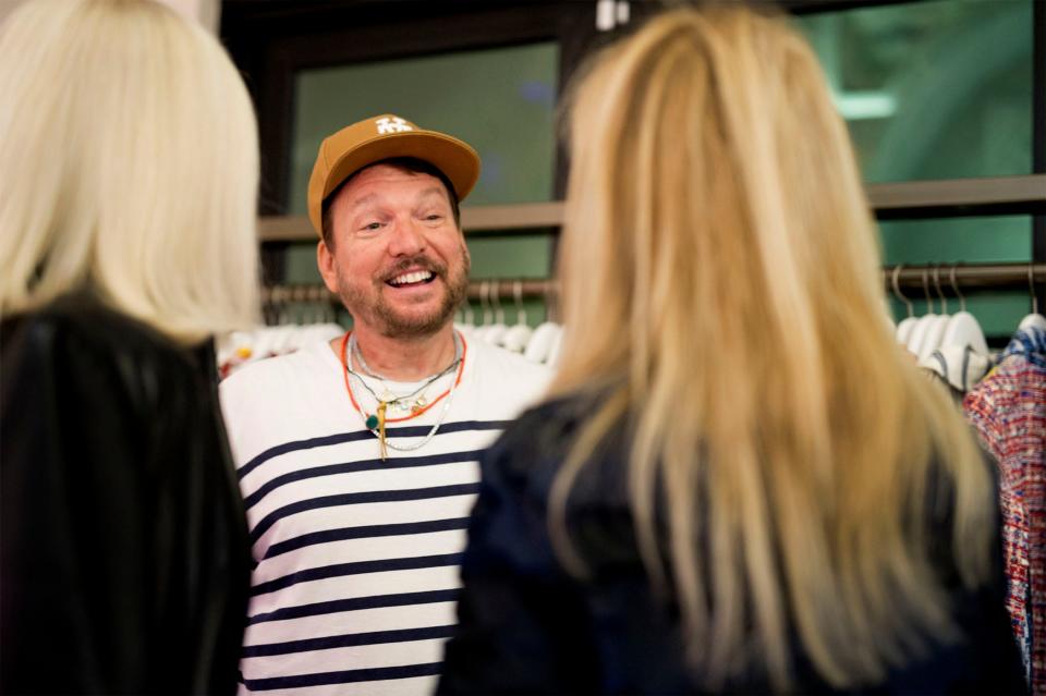 Libertine designer Johnson Hartig talks with visitors at Kirna Zabete during the event.