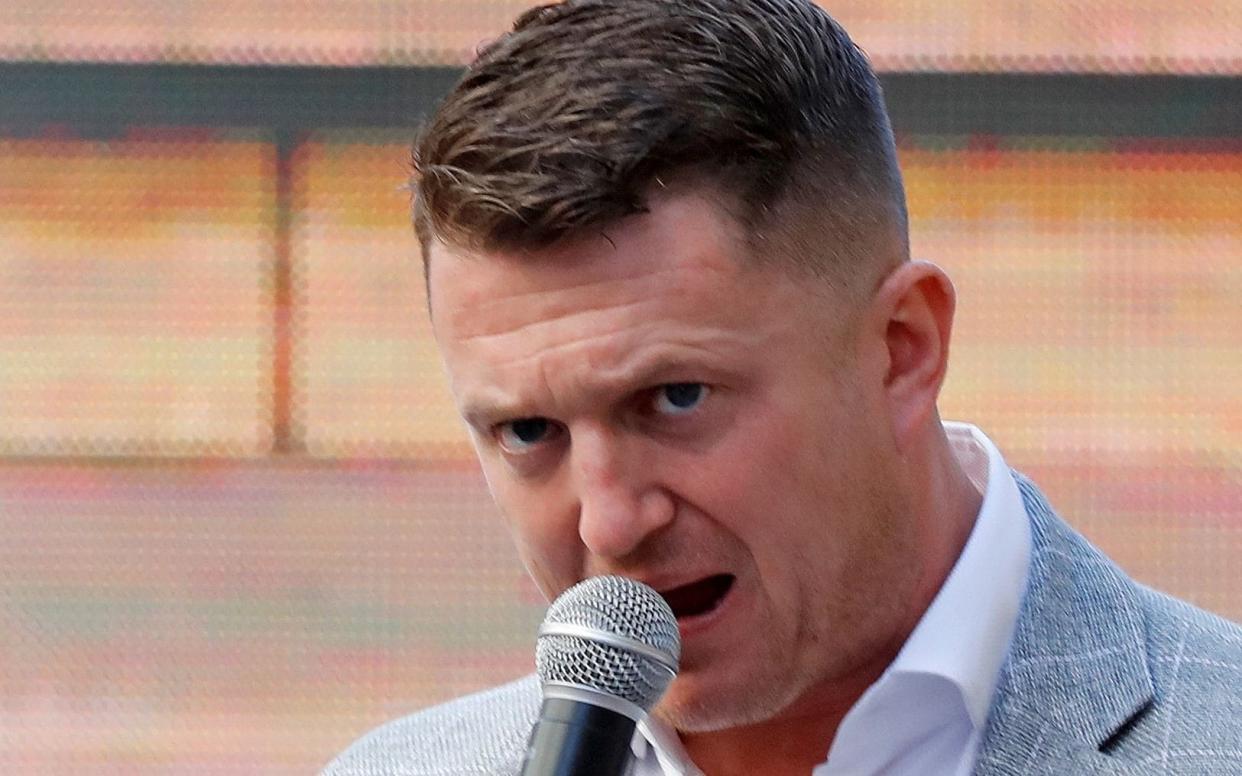 Robinson, whose real name is Stephen Yaxley-Lennon, addresses his supporters outside the Old Bailey - AFP