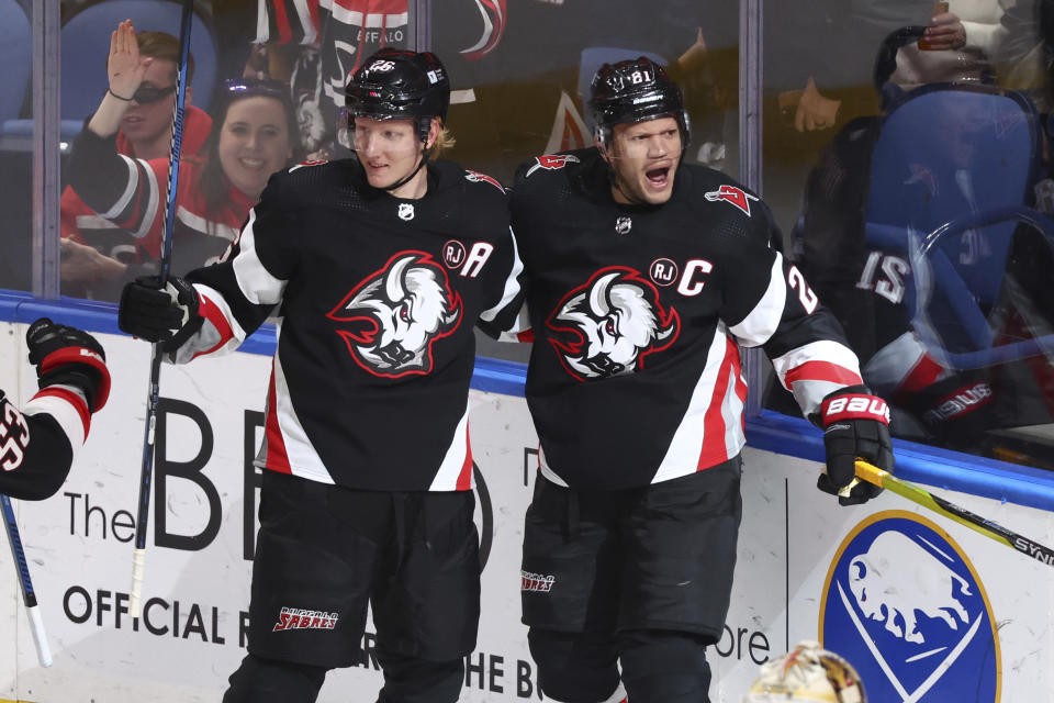 Buffalo Sabres right wing Kyle Okposo (21) celebrates his goal with defenseman Rasmus Dahlin (26) during the third period of an NHL hockey game against the Vegas Golden Knights Saturday, March 2, 2024, in Buffalo, N.Y. (AP Photo/Jeffrey T. Barnes)