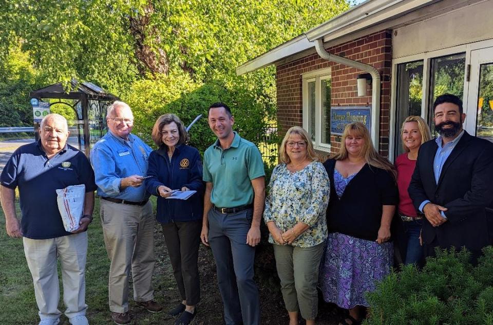 From left to right are Rotarians Phil Rinaldi, Gregg Dowty and Noreen Biehl present gift cards to the DHA team: Tim Granfield, Board Chair; Michele Bourasso, Family Self Sufficiency Specialist; Roxanne Osgood, Family and LIHTC Housing Specialist and Becky Daniels, Housing Choice Voucher Specialist and Exec. Director Ryan Crosby.