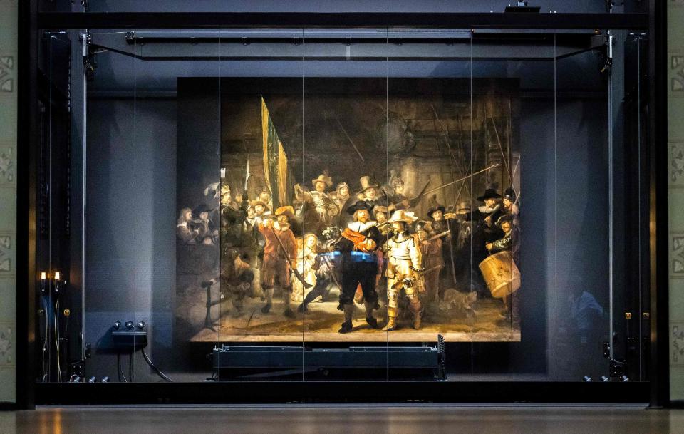 The remounted 1642 'Night Watch' is put in place at the Rijksmuseum Museum (ANP/AFP via Getty Images)